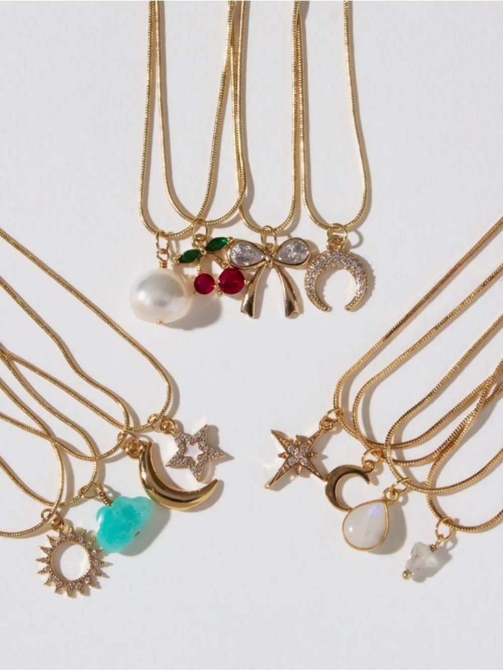 A394. Luna Norte Spring Gold 4 Strand Charm Necklace